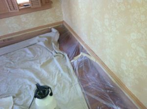 Wallpaper removal can be a messy job. Prepare with tarps or plastic.